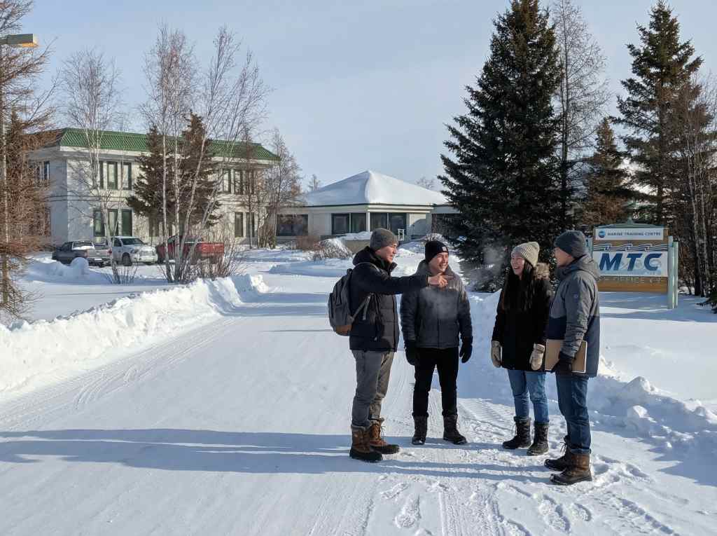 Students outside the Western Arctic Marine Training Centre in winter
